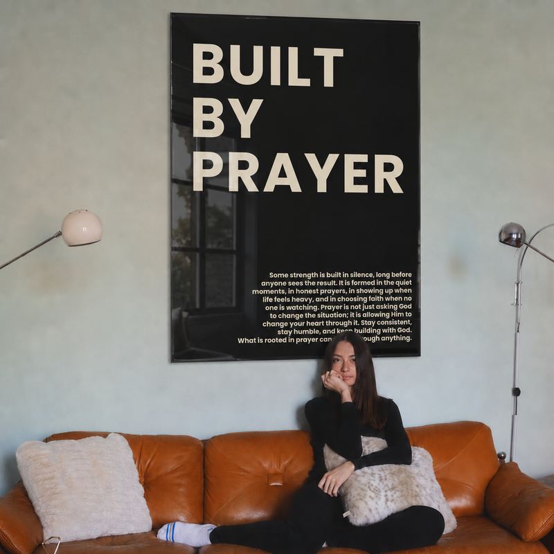 Built by Prayer acrylic glass art in a living room
