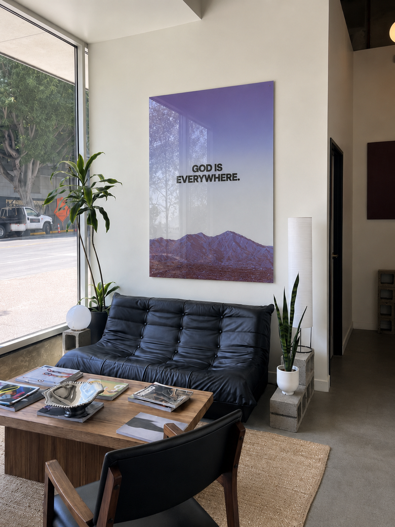 God Is Everywhere acrylic glass piece in a lounge