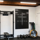 Do Not Fear Cross acrylic wall art in a home gym