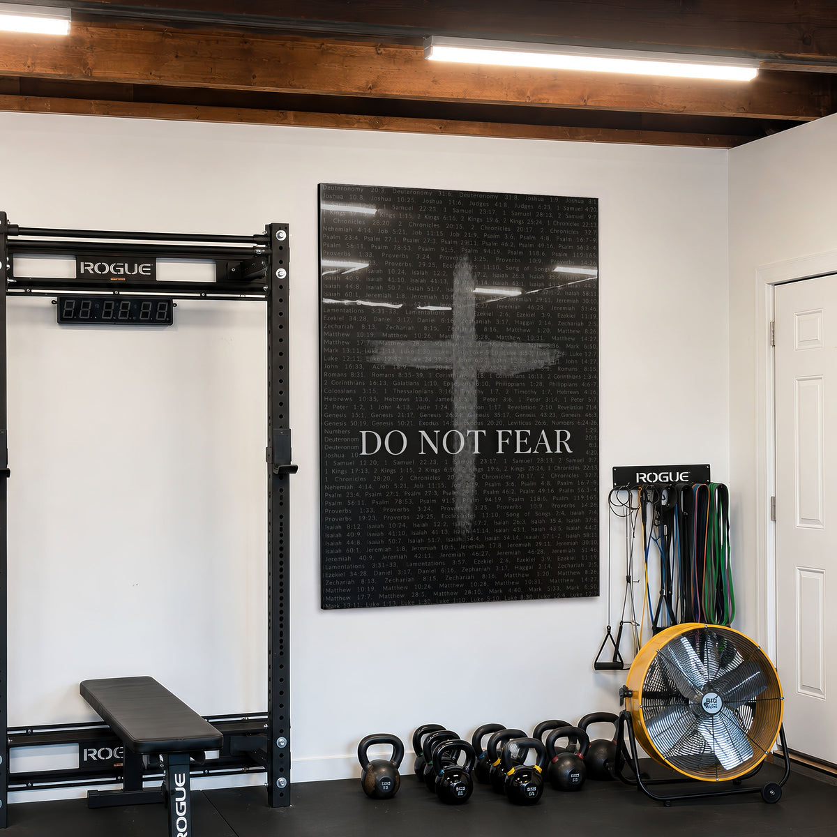 Do Not Fear Cross acrylic wall art in a home gym