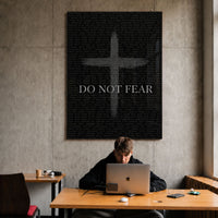 Do Not Fear Cross acrylic wall art above a workspace
