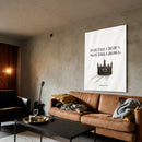 For The Crown acrylic wall art above a brown sofa