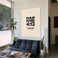 I Can Do All Things acrylic wall art displayed above a black sofa