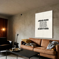 Jesus Over Everything cream acrylic wall art — brown sofa living room