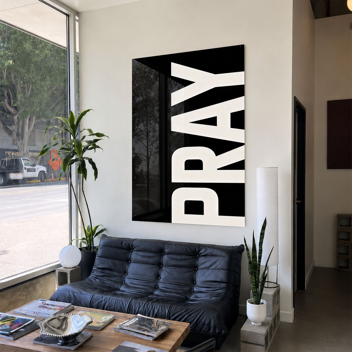 Pray black acrylic wall art — black sofa